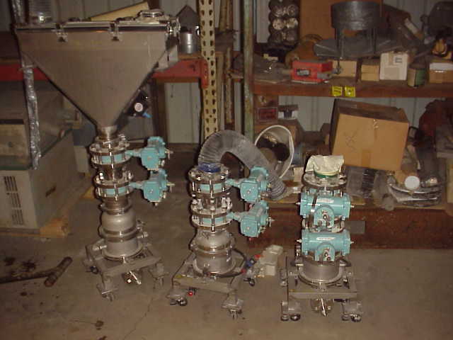Multi Actuator Valve system by TOMOE VALVE CO.  Type-Size 700Z-3Y-80MM, Seat-Disc EPDM-SCS14, Flange JIS 5k - 10k.  One has hopper mounted on top.