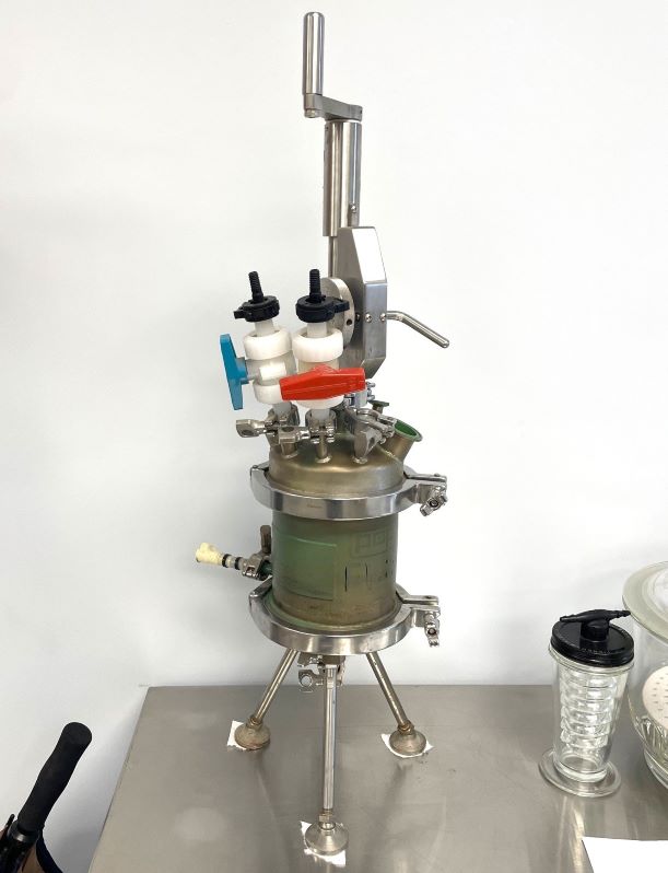 used Bench Top Pope Nutsche Filter Dryer. 1 Liter capacity. 316L Stainless Steel shell with Teflon lining rated 50/FV  @ 300 to (-20) Deg.F..  Jacket is 304L Stainless rated 50 PSI @ 300 Deg.F.. S/N 141407-1. Housing is 6