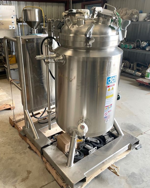 UNUSED DCI 150 Liter (40 Gallon) Sanitary Reactor/Fermenter with Top mounted 3 HP Agitation. Internal Rated 45/Full Vacuum PSI @ 225 Deg.F..  Jacket rated 150/FV @ 225 Deg.F.. Mounted on Skid with Control Panel with Temp and Mixer control. NB# 11222. S/N JS7104. 