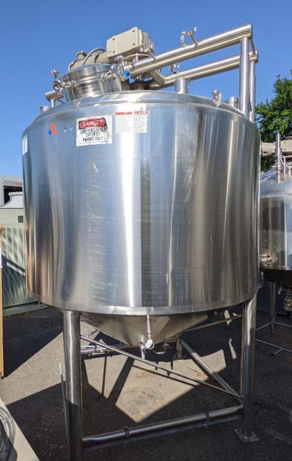 used 1500 Gallon APV Jacketed Processor / Kettle with Sweep Mixer Scrape surface agitation. Shell is 316L Stainless Steel. Jacketed rated 110 PSI @ 350 Deg.F..  Model PC, SN K-2451. 88 in. dia. x 53 in. straight side, with 26 in. cone bottom, dome top, top agitation with 5 hp Explosion Proof (XP) motor, full sweep, stationary baffle and dual spray ball. Top ports: (1) 18 in. dia. manway, (4) 4 in. sanitary fitting ports, (4) 2 in. sanitary fitting ports, (1) 1.5 in. sanitary fitting port. Side ports: (1) 2 in. sanitary fitting port, Bottom ports: (2) 1 in. female thread ports, (1) center discharge 3.5 in. flange fitting port, Discharge height 24.5 inches, Jacket ports: (8) 2 in. flange fitting ports (6 on side, 2 on bottom), USDA Model CCA, (4) picking eyes. Last used in Sanitary Food Plant. Jacket Hydro-tested good. Overall dimensions: 98 in. long x 92 in. wide x 147 in. tall. (1500 gallon; 5678 Liter)