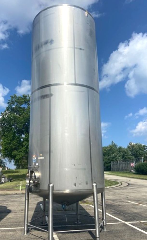 8000 Gallon Sanitary Stainless Steel Tank built by Cherry Burrell. Dish Top and Cone Bottom.  Has mount to add side entering mixer (Mixer not included). Top mount spray balls for CIP. Has top and side manways. 
