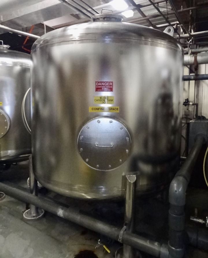 used 2,000 Gallon 316 Stainless Steel Pressure Vessel. Rated 65 PSI. Built by Western Filter. Model 86x60. 86
